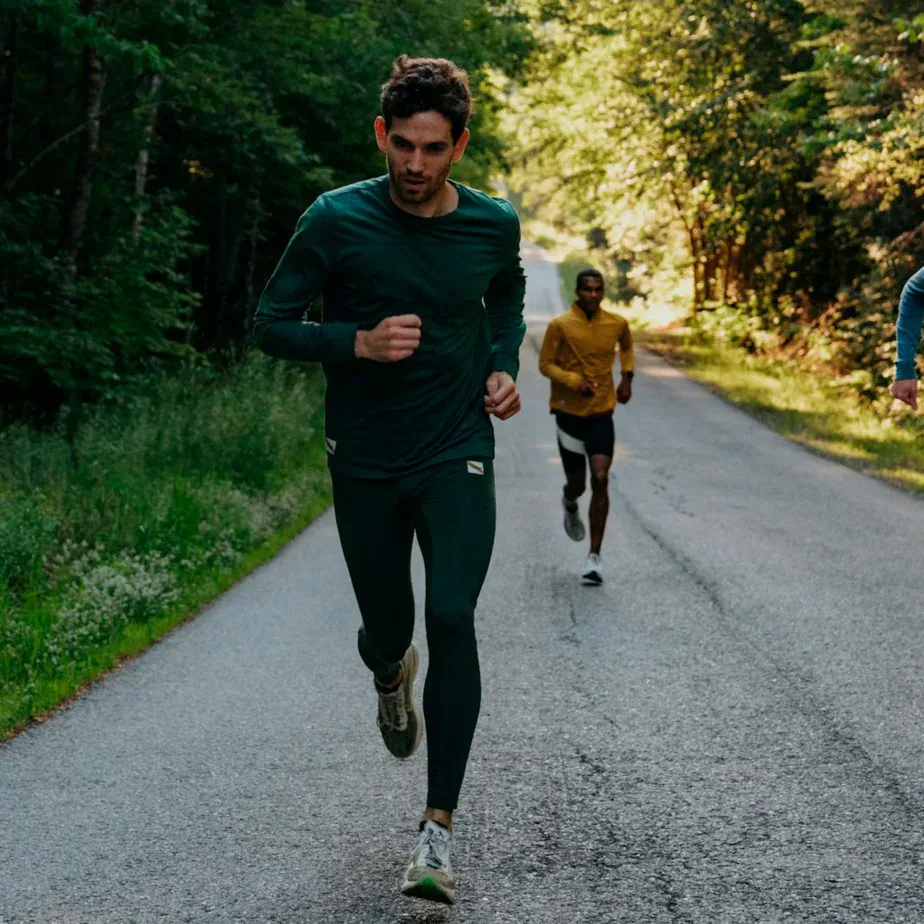 Trail runner training on a forest path