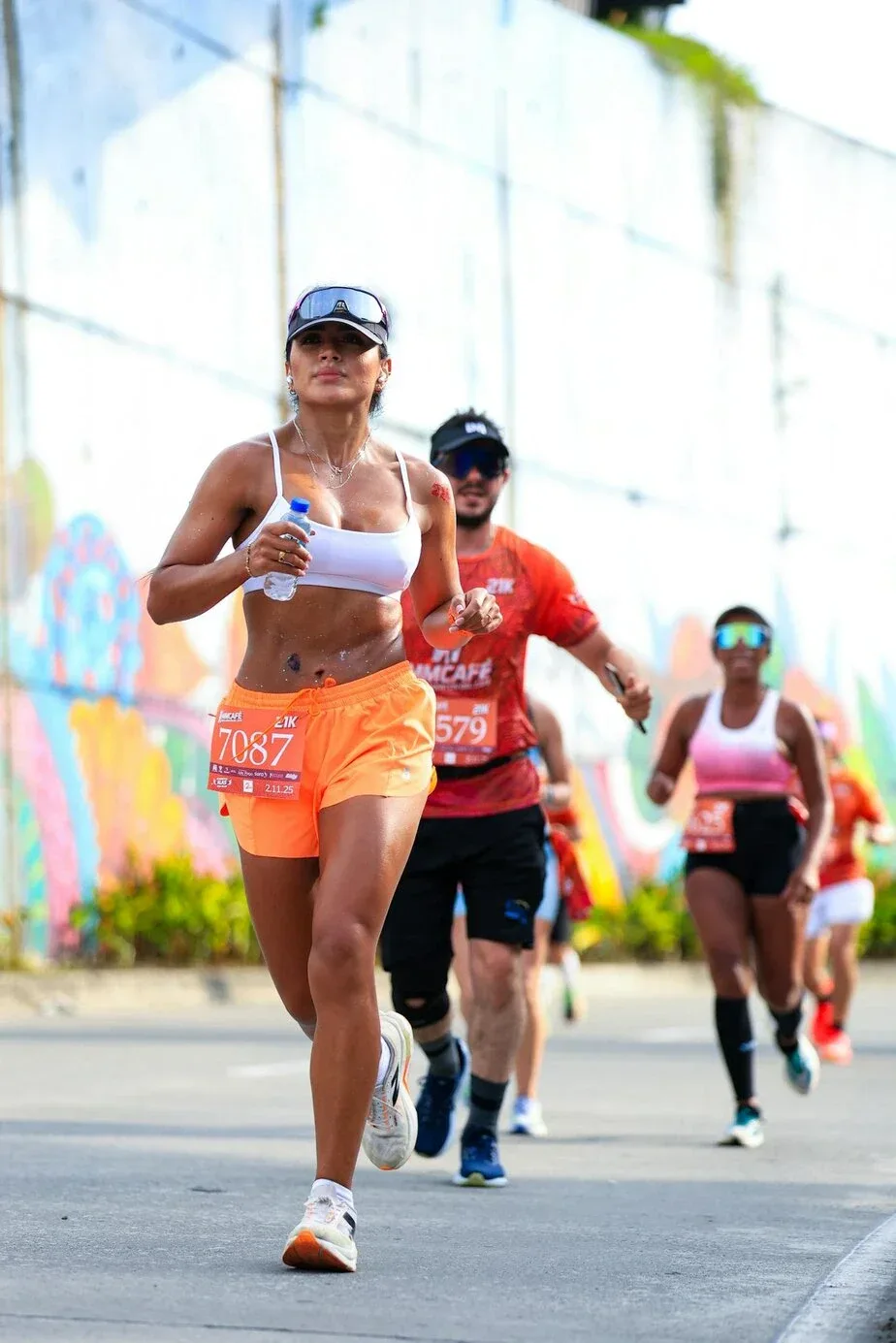 Marathon runners racing through a city
