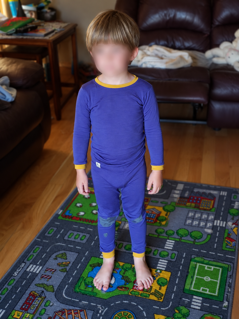 Child in Purple Pajamas on Play Rug 768x1024 1